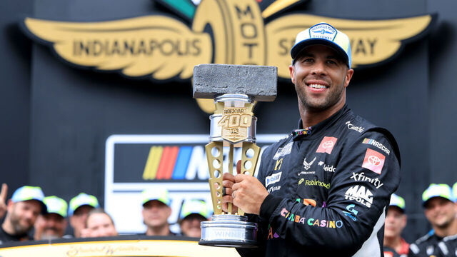 INDIANAPOLIS, INDIANA - JULY 27: Bubba Wallace, driver of the #23 Chumba Casino Toyota, poses with the Brickyard 400 trophy in victory lane after winning the NASCAR Cup Series Brickyard 400 Presented by PPG at Indianapolis Motor Speedway on July 27, 2025 in Indianapolis, Indiana.