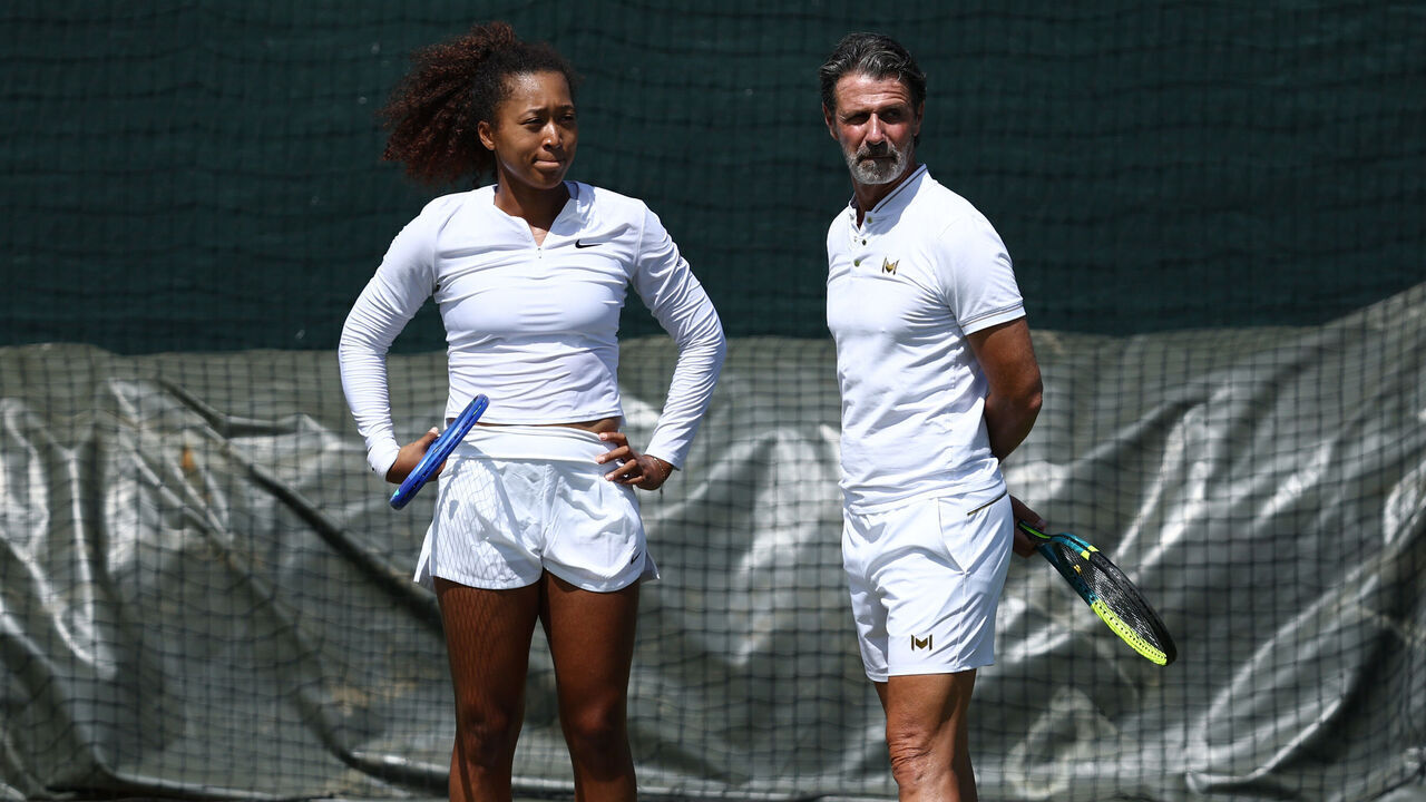 LONDON, ENGLAND - JUNE 27: Naomi Osaka of Japan and her coach, Patrick Mouratoglou, look on during a practice session prior to The Championships Wimbledon 2025 at All England Lawn Tennis and Croquet Club on June 27, 2025 in London, England.