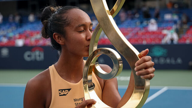 WASHINGTON, DC - JULY 27: Leylah Fernandez of Canada kisses the championship trophy after winning a women's singles championship match against Anna Kalinskaya on the final day of the Mubadala Citi DC Open 2025 at William H.G. FitzGerald Tennis Center on July 27, 2025 in Washington, DC.