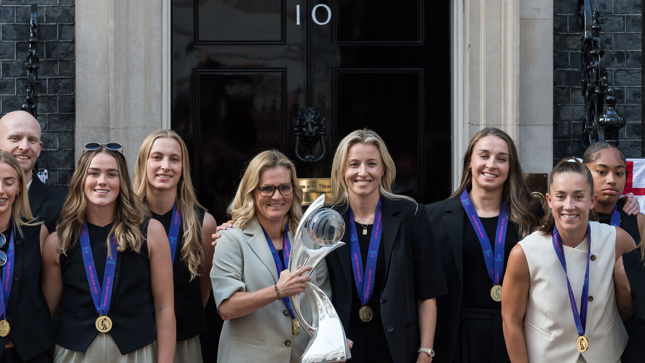 LONDON, UNITED KINGDOM - JULY 28: Team Manager Sarina Wiegman holds the EURO 2025 trophy as England Women's National Football Team, the Lionesses, pose outside 10 Downing Street ahead of a reception to celebrate the defence of their European title in London, United Kingdom on July 28, 2025. The Lionesses defeated the World Champions Spain on penalties in the UEFA Women's EURO 2025 final in Basel last night with the celebrations to continue in London with an open top bus parade tomorrow.