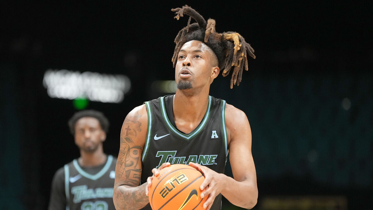 LAS VEGAS, NV - APRIL 01: Gregg Glenn III #2 of the Tulane Green Wave lakes a foul shot during the 1st round of the Crown College Basketball Championship against the USC Trojans at the MGM Garden Arena on April 01, 2025 in Las Vegas, Nevada.