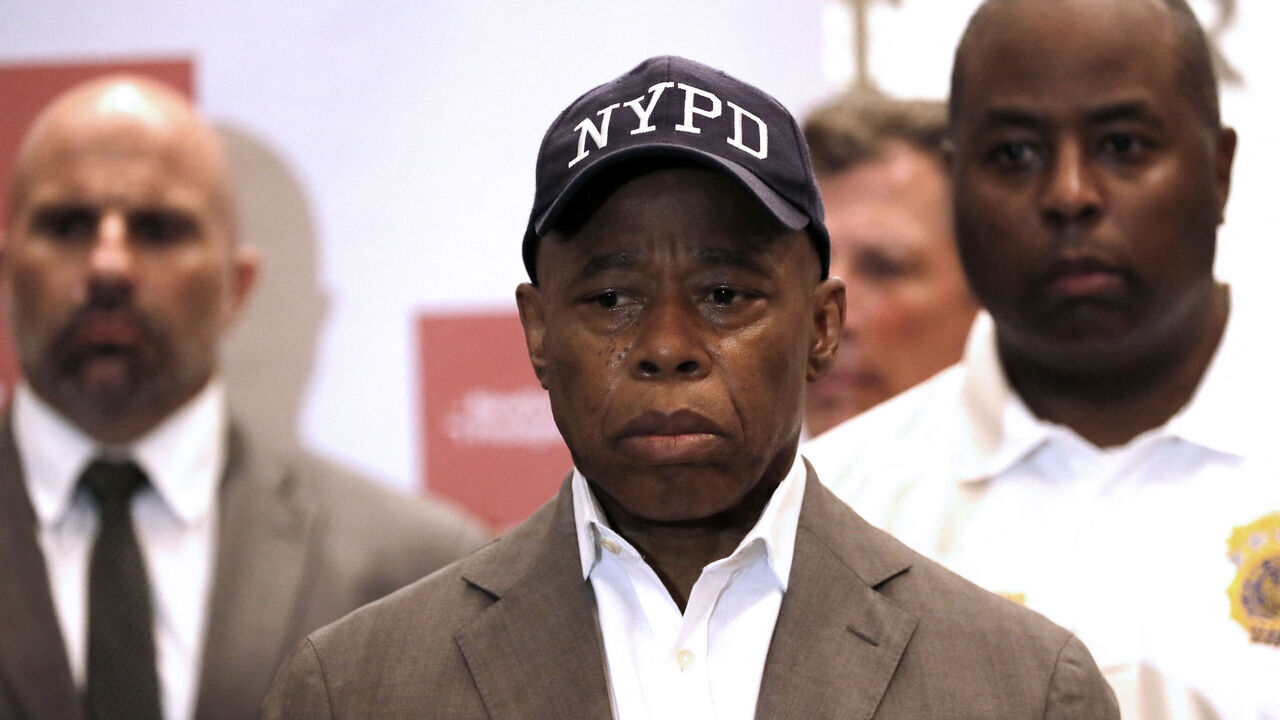 New York City Mayor Eric Adams (C) and City officials hold a press conference at the David H. Koch Center following a shooting in Midtown in which four people including a police officer were killed, on July 28, 2025 in New York City. Five people including a police officer and a suspected gunman were dead following a shooting July 28, 2025 at a skyscraper in central Manhattan, US media reported. The incident began around 6:00 pm (2200 GMT) when reports of gunfire prompted hundreds of police to a busy office district on the storied Park Avenue, an area popular with tourists