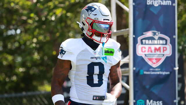 FOXBOROUGH, MA - JULY 28: New England Patriots cornerback Christian Gonzalez (0) walks to the field during New England Patriots training camp on July 28, 2025 at Gillette Stadium in Foxborough, Massachusetts.