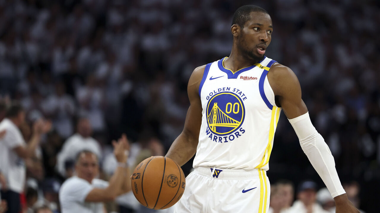 MINNEAPOLIS, MINNESOTA - MAY 14: Jonathan Kuminga #00 of the Golden State Warriors handles the ball during the first quarter of Game Five of the Western Conference Second Round NBA Playoffs against the Minnesota Timberwolves at Target Center on May 14, 2025 in Minneapolis, Minnesota.