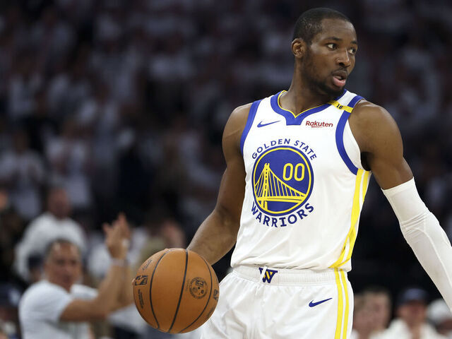 MINNEAPOLIS, MINNESOTA - MAY 14: Jonathan Kuminga #00 of the Golden State Warriors handles the ball during the first quarter of Game Five of the Western Conference Second Round NBA Playoffs against the Minnesota Timberwolves at Target Center on May 14, 2025 in Minneapolis, Minnesota.