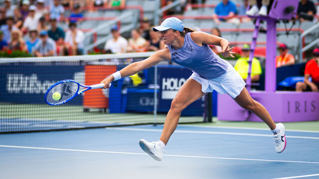 MONTREAL, QUEBEC - JULY 30: Iga Swiatek of Poland in action against Hanyu Guo of China in the second round of the National Bank Open at Stade IGA on July 30, 2025 in Montreal, Quebec