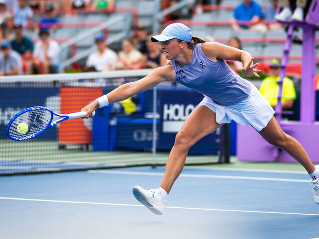MONTREAL, QUEBEC - JULY 30: Iga Swiatek of Poland in action against Hanyu Guo of China in the second round of the National Bank Open at Stade IGA on July 30, 2025 in Montreal, Quebec