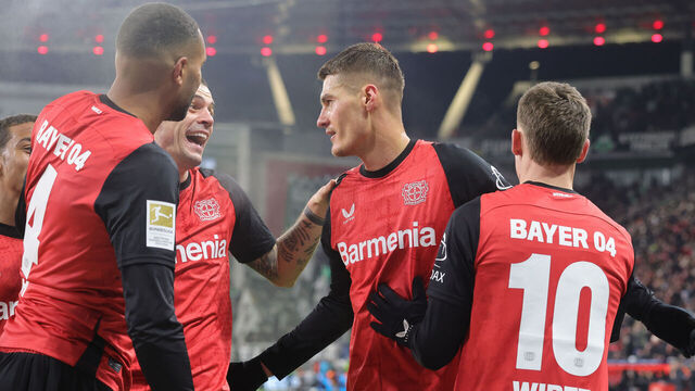 LEVERKUSEN, GERMANY - JANUARY 18: (LR) Jonathan Tah of Bayer Leverkusen Granit Xhaka of Bayer Leverkusen Patrik Schick of Bayer and Florian Wirtz of Bayer Leverkusen celebrate the teams third goal during the Bundesliga match between Bayer 04 Leverkusen and Borussia Mönchengladbach at BayArena on January 18, 2025 in Leverkusen, Germany.
