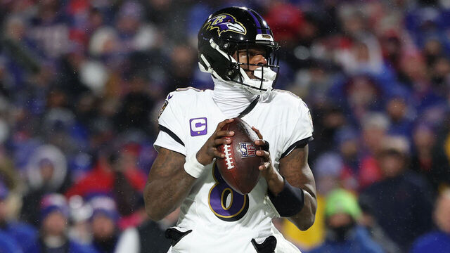 ORCHARD PARK, NEW YORK - JANUARY 19: Lamar Jackson #8 of the Baltimore Ravens steps back to pass against the Buffalo Bills in the third quarter during the AFC Divisional Playoff at Highmark Stadium on January 19, 2025 in Orchard Park, New York.