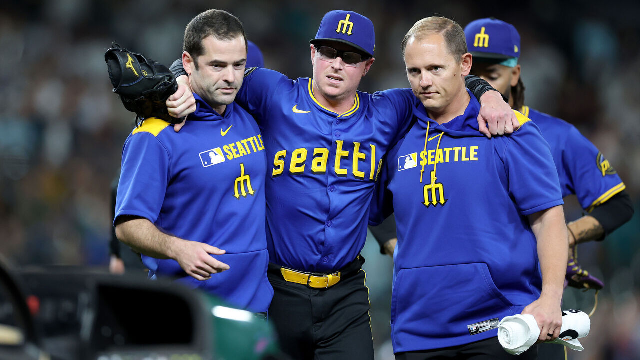 SEATTLE, WASHINGTON - JULY 31: Trent Thornton #46 of the Seattle Mariners is taken off the field on a cart after an injury during the ninth inning against the Texas Rangers at T-Mobile Park on July 31, 2025 in Seattle, Washington.