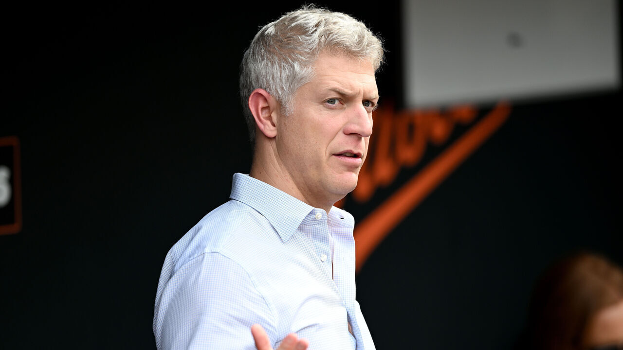 BALTIMORE, MARYLAND - JUNE 13: General Manager Mike Elias of the Baltimore Orioles watches batting practice before the game against the Los Angeles Angels at Oriole Park at Camden Yards on June 13, 2025 in Baltimore, Maryland.