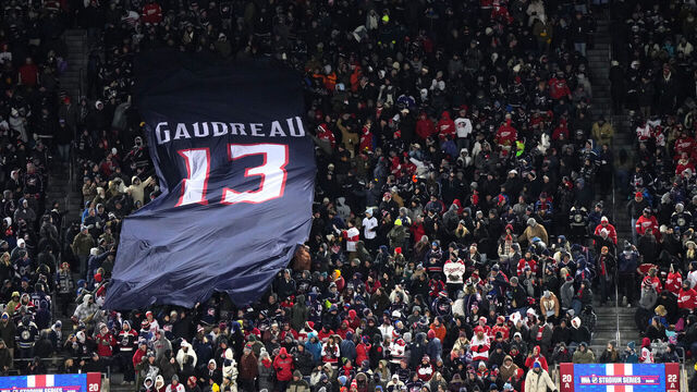COLUMBUS, OHIO - MARCH 01: A banner commemorating the late Johnny Gaudreau #13 of the Columbus Blue Jackets is passed along by fans in the stadium during the second period of the NHL Stadium Series game between the Detroit Red Wings and the Columbus Blue Jackets at Ohio Stadium on March 01, 2025 in Columbus, Ohio.