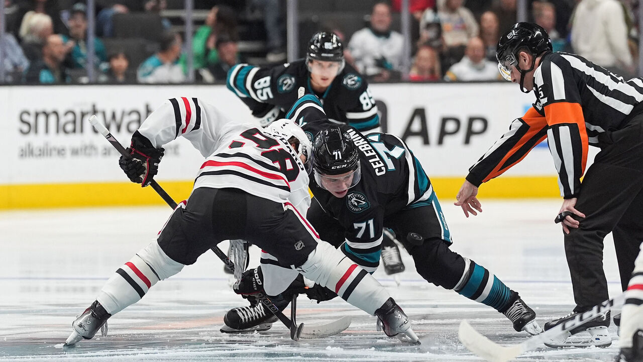 SAN JOSE, CA - MARCH 13: Macklin Celebrini #71 of the San Jose Sharks takes a face-off against Connor Bedard #98 of the Chicago Blackhawks in the first period at SAP Center on March 13, 2025 in San Jose, California.