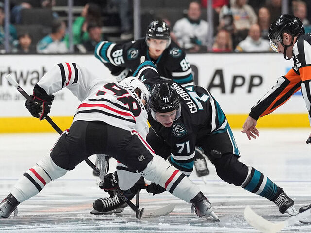 SAN JOSE, CA - MARCH 13: Macklin Celebrini #71 of the San Jose Sharks takes a face-off against Connor Bedard #98 of the Chicago Blackhawks in the first period at SAP Center on March 13, 2025 in San Jose, California.