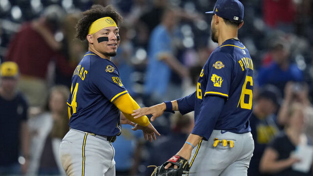 WASHINGTON, DC - AUGUST 01: William Contreras #24 and Blake Perkins #16 of the Milwaukee Brewers celebrate after winning the game against the Washington Nationals at Nationals Park on August 01, 2025 in Washington, DC.