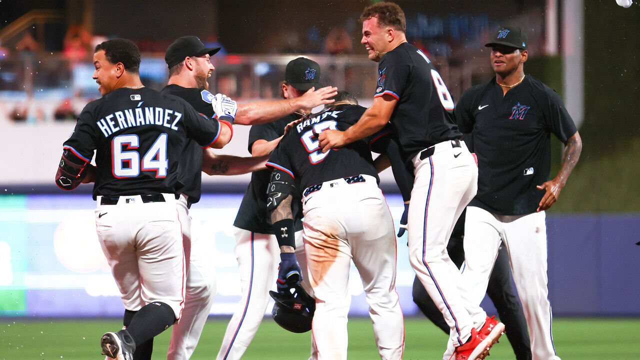 MIAMI, FLORIDA - AUGUST 01: Agustín Ramírez #50 of the Miami Marlins celebrates with teammates after walking it off to defeat the New York Yankees at loanDepot park on August 01, 2025 in Miami, Florida.
