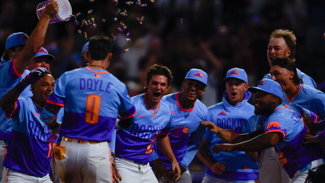 DENVER, CO - AUGUST 1: The Rockies celebrates as Brenton Doyle #9 of the Colorado Rockies crosses home plate after hitting a walk-off two run home run in the ninth inning against the Pittsburgh Pirates at Coors Field on August 1, 2025 in Denver, Colorado. The Rockies overcame a 9 run first inning by the Pirates to win the game 17-16.