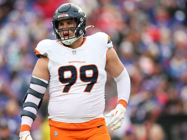 ORCHARD PARK, NEW YORK - JANUARY 12: Zach Allen #99 of the Denver Broncos reacts after a sack against the Buffalo Bills in the second quarter during the AFC Wild Card Playoffs at Highmark Stadium on January 12, 2025 in Orchard Park, New York.