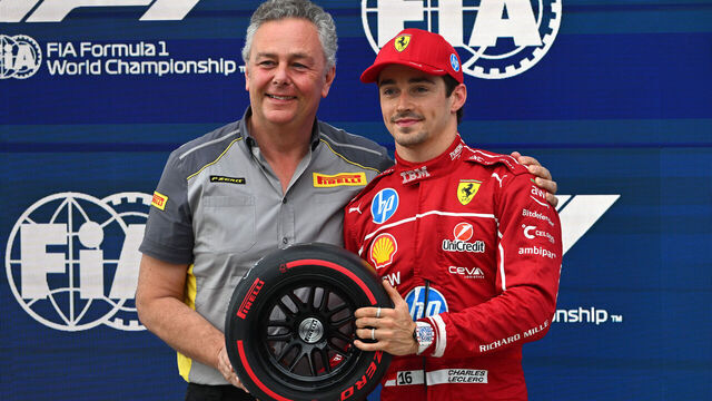 BUDAPEST, HUNGARY - AUGUST 02: Mario Isola, Director of Pirelli F1 presents Pole position qualifier Charles Leclerc of Monaco and Scuderia Ferrari with his Pirelli Pole Position award during qualifying ahead of the F1 Grand Prix of Hungary at Hungaroring on August 02, 2025 in Budapest, Hungary.