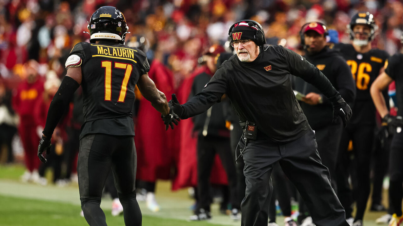 LANDOVER, MD - DECEMBER 01: Terry McLaurin #17 of the Washington Commanders celebrates with head coach Dan Quinn after catching a pass against the Tennessee Titans during the second half of the game at Northwest Stadium on December 1, 2024 in Landover, Maryland.