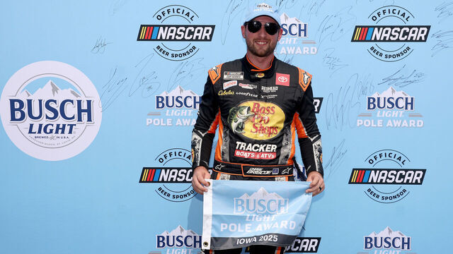 NEWTON, IOWA - AUGUST 02: Chase Briscoe, driver of the #19 Bass Pro Shops Toyota, poses for photos after winning the pole award during qualifying for the NASCAR Cup Series Iowa Corn 350 Powered by Ethanol at Iowa Speedway on August 02, 2025 in Newton, Iowa.