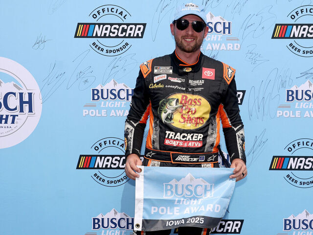 NEWTON, IOWA - AUGUST 02: Chase Briscoe, driver of the #19 Bass Pro Shops Toyota, poses for photos after winning the pole award during qualifying for the NASCAR Cup Series Iowa Corn 350 Powered by Ethanol at Iowa Speedway on August 02, 2025 in Newton, Iowa.