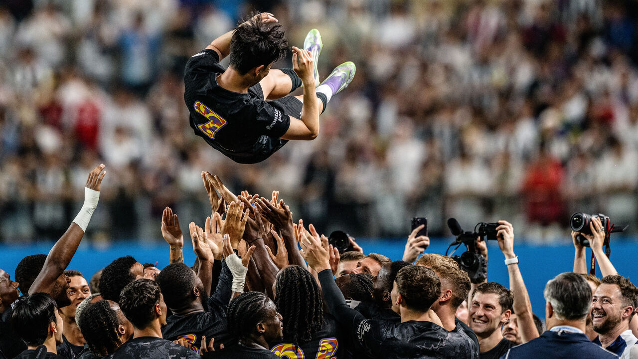 Teammates lift Tottenham Hotspur's captain Son Heung-min up in the air during celebrations to bid him farewell at the end of a friendly football match between Tottenham Hotspur and Newcastle United in Seoul on August 3, 2025. The 33-year-old South Korean striker said on August 2, that he will leave the club this summer after a decade in north London.