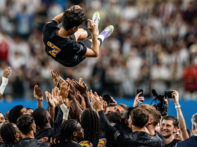 Teammates lift Tottenham Hotspur's captain Son Heung-min up in the air during celebrations to bid him farewell at the end of a friendly football match between Tottenham Hotspur and Newcastle United in Seoul on August 3, 2025. The 33-year-old South Korean striker said on August 2, that he will leave the club this summer after a decade in north London.