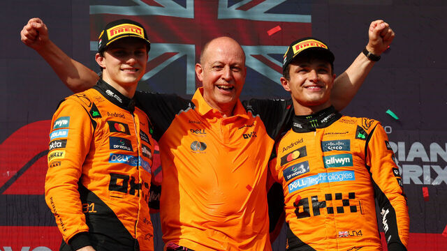BUDAPEST, HUNGARY - AUGUST 03: Race winner Lando Norris of Great Britain and McLaren Second placed Oscar Piastri of Australia and McLaren and Mark Ingham, Head of Design at McLaren on the podium during the F1 Grand Prix of Hungary at Hungaroring on August 03, 2025 in Budapest, Hungary.