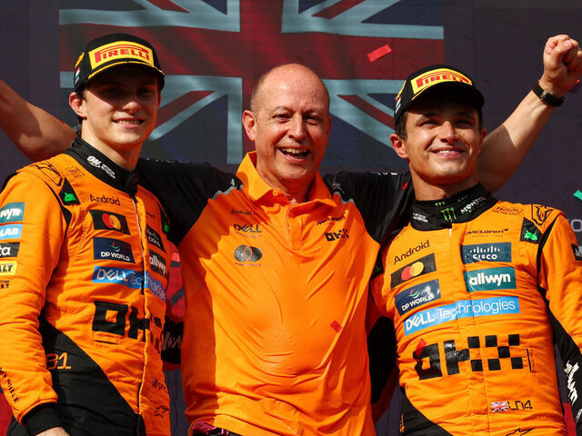 BUDAPEST, HUNGARY - AUGUST 03: Race winner Lando Norris of Great Britain and McLaren Second placed Oscar Piastri of Australia and McLaren and Mark Ingham, Head of Design at McLaren on the podium during the F1 Grand Prix of Hungary at Hungaroring on August 03, 2025 in Budapest, Hungary.