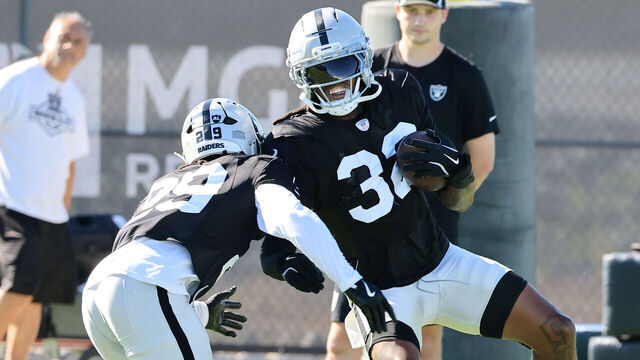 HENDERSON, NEVADA - JULY 28: Chris Smith II #29 and Lonnie Johnson Jr. #32 of the Las Vegas Raiders practice during the team's training camp at the Las Vegas Raiders Headquarters/Intermountain Health Performance Center on July 28, 2025 in Henderson, Nevada.
