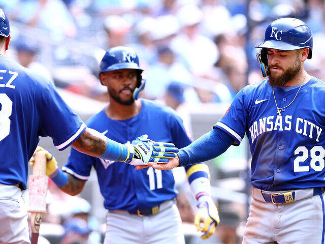 TORONTO, ON - AUGUST 03: Kyle Isbel #28 of the Kansas City Royals celebrates scoring a run with Salvador Perez #13 on a single by Tyler Tolbert #2 in the tenth inning during a game against the Toronto Blue Jays at Rogers Centre on August 03, 2025 in Toronto, Ontario, Canada.