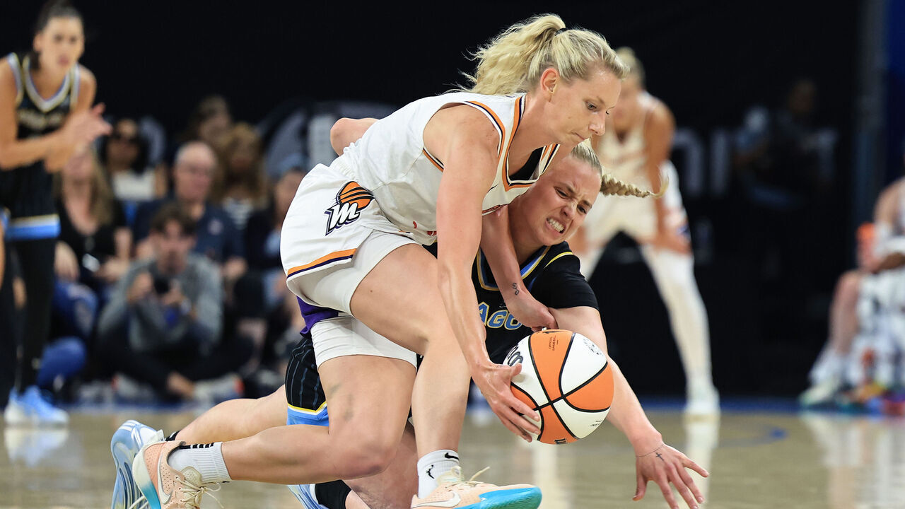 CHICAGO, ILLINOIS - AUGUST 03: Lexi Held #1 of the Phoenix Mercury and Hailey Van Lith #2 of the Chicago Sky battle for a ball during the first half at Wintrust Arena on August 3, 2025 in Chicago, Illinois.