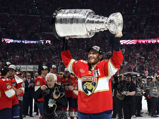 SUNRISE, FLORIDA - JUNE 17: Matthew Tkachuk #19 of the Florida Panthers hoists the Stanley Cup after Game Six of the 2025 Stanley Cup Final between the Edmonton Oilers and the Florida Panthers at Amerant Bank Arena on June 17, 2025 in Sunrise, Florida. The Panthers won the Stanley Cup Final series 4-2.