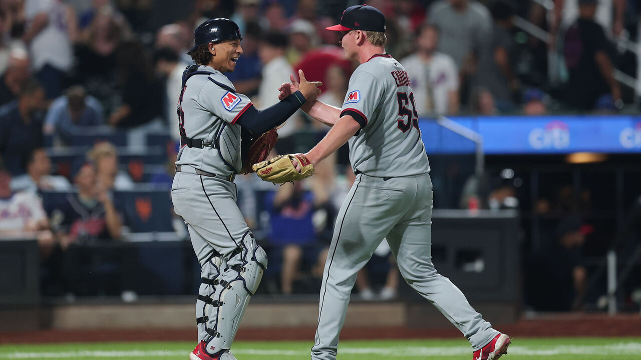 NEW YORK, NEW YORK - AUGUST 04: Nic Enright #59 and Bo Naylor #23 of the Cleveland Guardians celebrate a 7-6 victory in 10 innings over the New York Mets at Citi Field on August 04, 2025 in New York City.