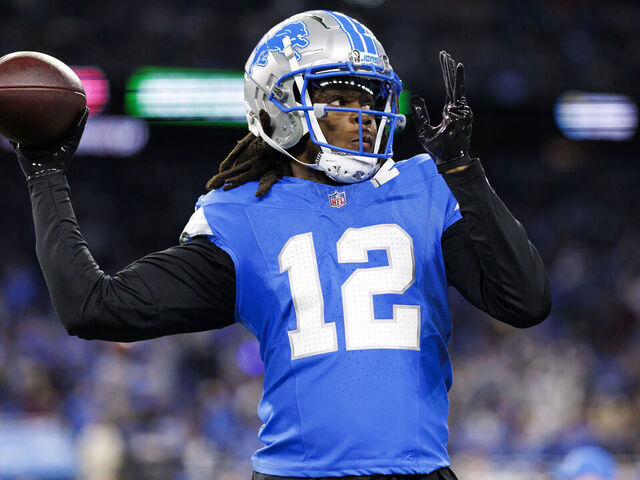 DETROIT, MICHIGAN - JANUARY 18: Quarterback Teddy Bridgewater #12 of the Detroit Lions warms up during an NFL football divisional playoff game against the Washington Commanders, at Ford Field on January 18, 2025 in Detroit, Michigan.