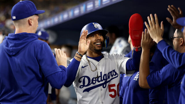 LOS ANGELES, CALIFORNIA - AUGUST 05: Mookie Betts #50 of the Los Angeles Dodgers celebrates scoring in the eighth inning against the St. Louis Cardinals at Dodger Stadium on August 05, 2025 in Los Angeles, California.