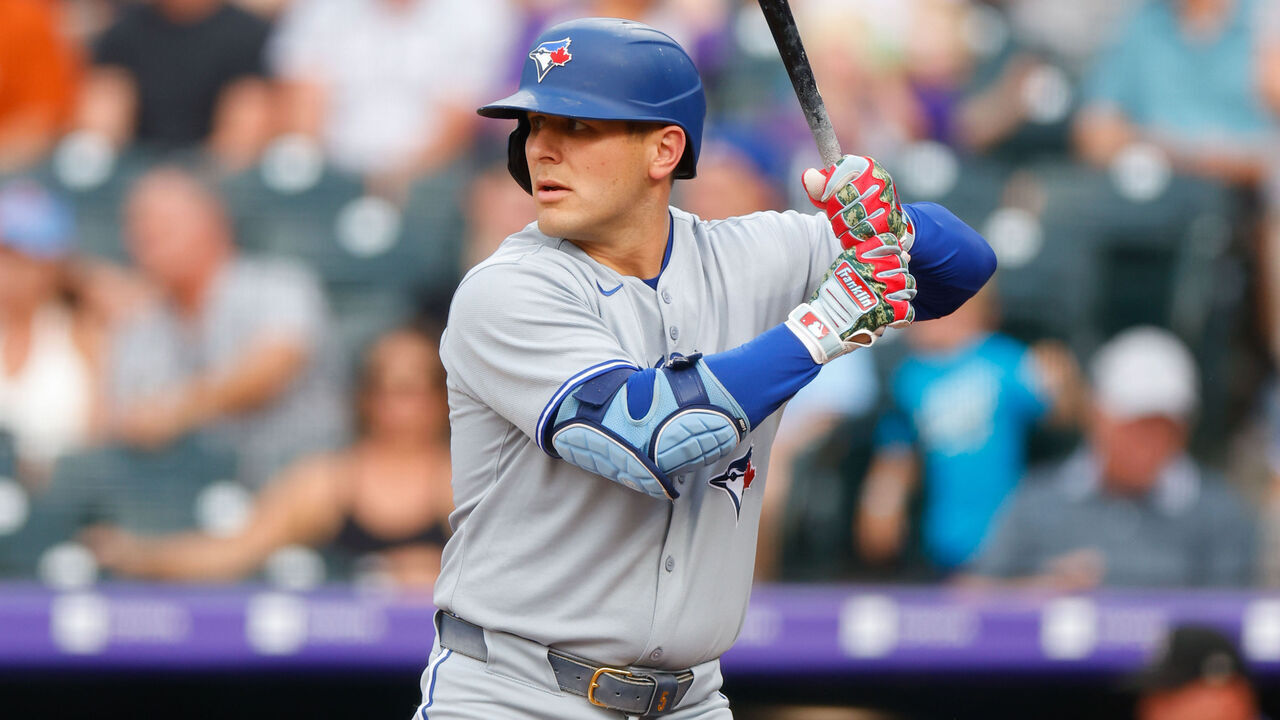 DENVER, CO - AUGUST 5: Daulton Varsho #5 of the Toronto Blue Jays bats in the second inning against the Colorado Rockies at Coors Field on August 5, 2025 in Denver, Colorado.