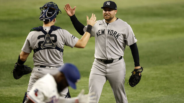 ARLINGTON, TX - AUGUST 6: David Bednar #53 of the New York Yankees and teammate Ben Rice #22 celebrate following the team's win over the Texas Rangers at Globe Life Field on August 6, 2025 in Arlington, Texas.