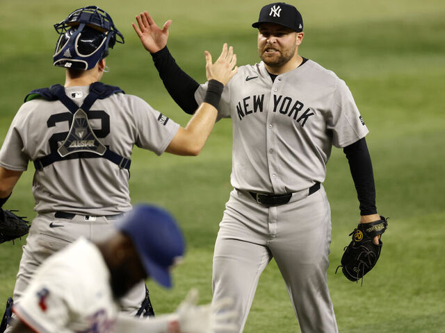 ARLINGTON, TX - AUGUST 6: David Bednar #53 of the New York Yankees and teammate Ben Rice #22 celebrate following the team's win over the Texas Rangers at Globe Life Field on August 6, 2025 in Arlington, Texas.