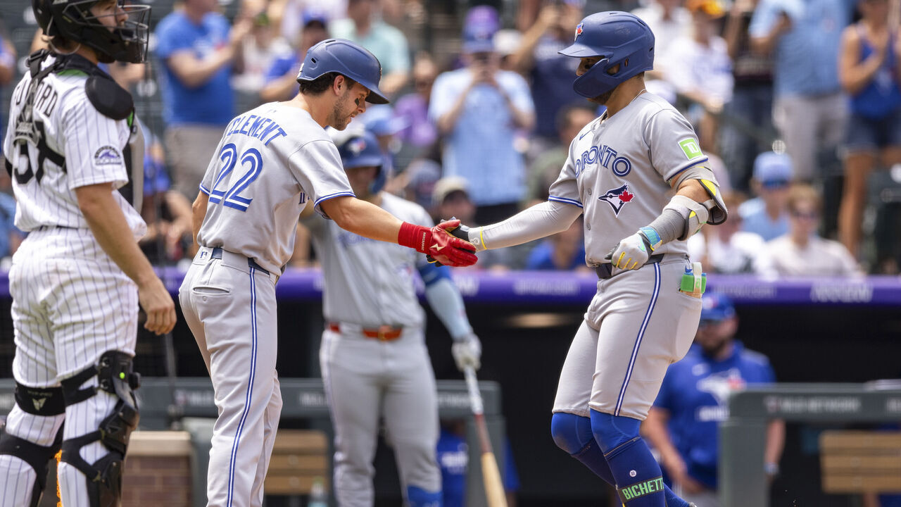 DENVER, CO - AUGUST 06: Bo Bichette #11 of the Toronto Blue Jays celebrates after hitting a home run during the game between the Toronto Blue Jays and the Colorado Rockies at Coors Field on Wednesday, August 6, 2025 in Denver, Colorado.