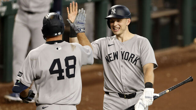 ARLINGTON, TX - AUGUST 6: Paul Goldschmidt #48 of the New York Yankees celebrates with teammate Ben Rice #22 after hitting a solo home run against the Texas Rangers during the seventh inning at Globe Life Field on August 6, 2025 in Arlington, Texas.
