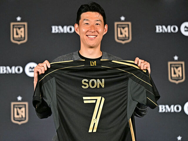 South Korean football player Son Heung-min holds his LAFC jersey during a press conference as he joins the Los Angeles FC (LAFC) at BMO Stadium's Field Club in Los Angeles on August 6, 2025. South Korea star Son Heung-min has signed for Los Angeles FC, bringing to an end his 10-year stay at Tottenham, both clubs announced on August 6, 2025. The 33-year-old will reportedly cost a Major League Soccer record $26 million transfer fee, according to ESPN and The Athletic.