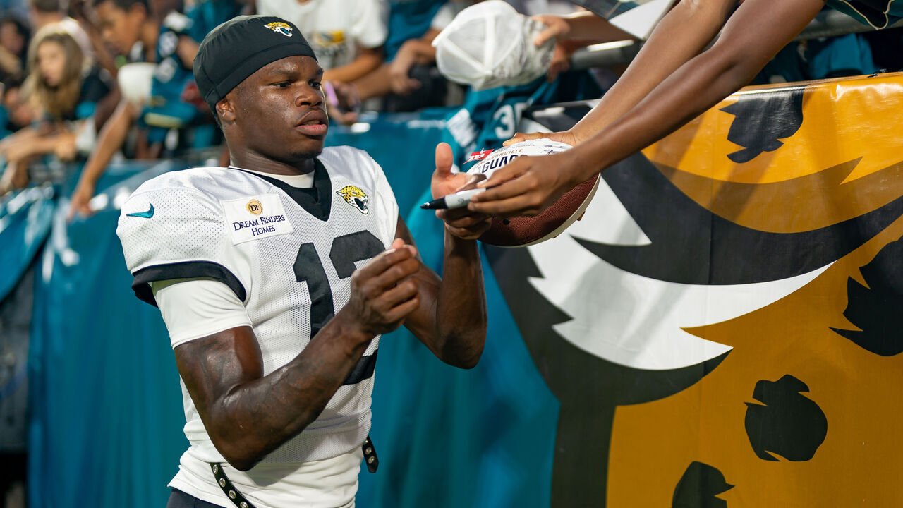 JACKSONVILLE, FL - AUGUST 01:Jacksonville Jaguars wide receiver Travis Hunter (12) signs autographs with fans after a scrimmage between the Jacksonville Jaguars at EverBank Stadium in Jacksonville,FL.