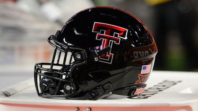 AUSTIN, TX - NOVEMBER 24: A Texas Tech Red Raiders helmet rests on the sidelines during college football game between the Texas Tech Red Raiders and the Texas Longhorns on November 24, 2023, at Darrell K Royal-Texas Memorial Stadium in Austin, TX.