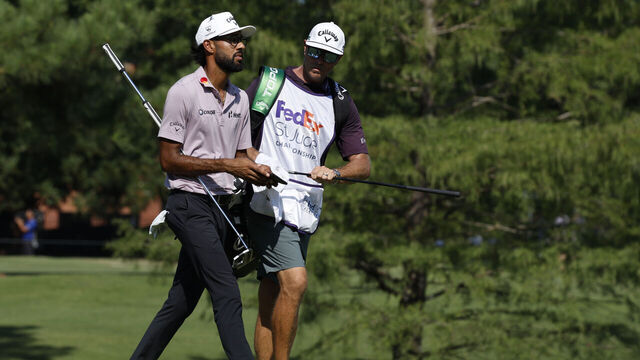 MEMPHIS, TN - AUGUST 07: Akshay Bhatia of United States and his caddie walk to the No. 9 green during the first round of the FedEx St. Jude Championship, August 7, 2025, at TPC Southward in Memphis, Tennessee.