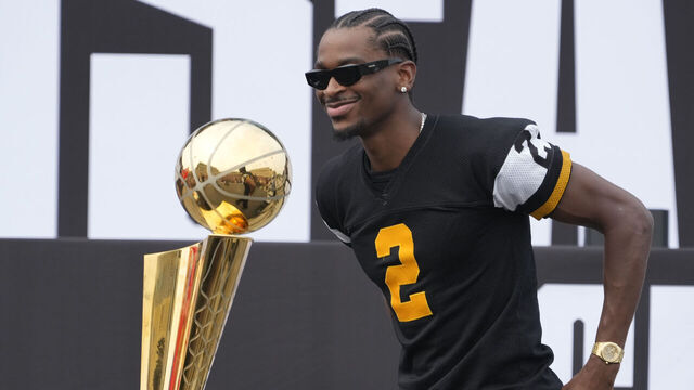 HAMILTON, CANADA - AUGUST 7: Shai Gilgeous-Alexander #2 of the Oklahoma City Thunder and the Larry O'Brien NBA championship trophy on Shai Rally Day held before a game between the BC Lions and Hamilton Tiger-Cats at Hamilton Stadium on August 7, 2025 in Hamilton, Canada.