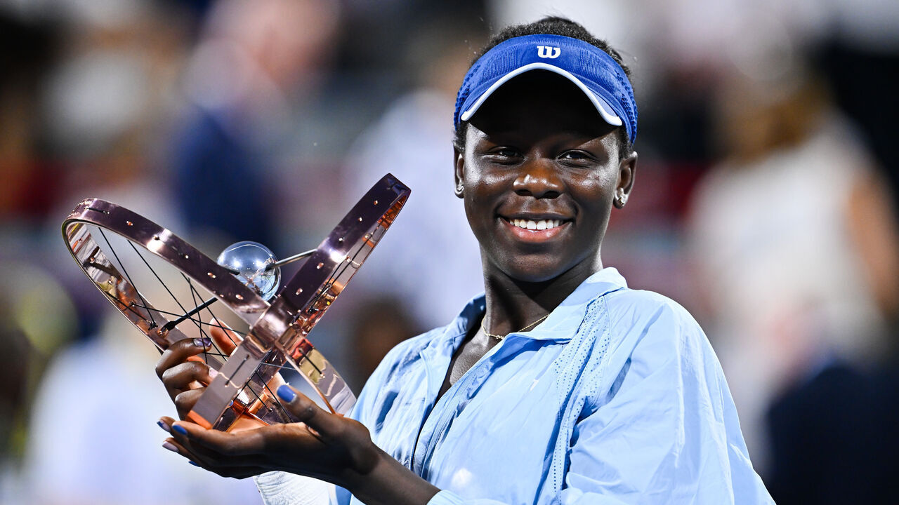 MONTREAL, CANADA - AUGUST 07: Victoria Mboko of Canada celebrates as she holds up the trophy following her victory against Naomi Osaka of Japan during the Women's Singles Final match on day twelve of the WTA 1000 National Bank Open at IGA Stadium on August 7, 2025 in Montreal, Quebec, Canada.