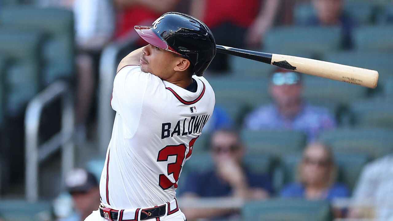 ATLANTA, GEORGIA - AUGUST 07: Drake Baldwin #30 of the Atlanta Braves hits a solo homer in the second inning against the Miami Marlins at Truist Park on August 07, 2025 in Atlanta, Georgia.