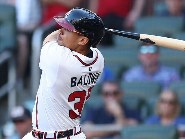 ATLANTA, GEORGIA - AUGUST 07: Drake Baldwin #30 of the Atlanta Braves hits a solo homer in the second inning against the Miami Marlins at Truist Park on August 07, 2025 in Atlanta, Georgia.
